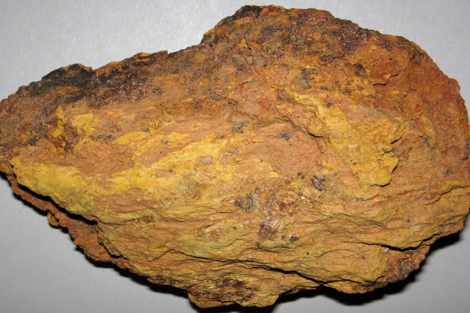 An oxidized gossan, the rusty surface cap of a mineral deposit